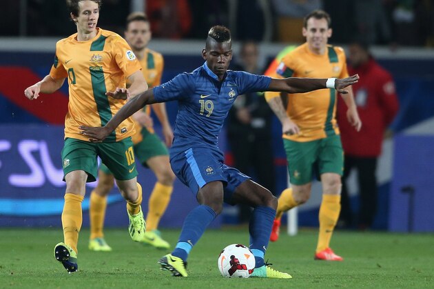 PARIS, FRANCE - OCTOBER 11:  Paul Pogba of France passes the ball during the International Friendly match between France and Australia at Parc des Princes on October 11, 2013 in Paris, France.  (Photo by David Rogers/Getty Images)