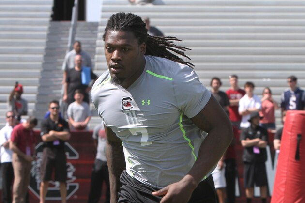 South Carolina defensive end Jadeveon Clowney competes in a drill for NFL representatives at South Carolina football pro day in Columbia, S.C., Wednesday, April 2, 2014. (AP Photo/Mary Ann Chastain)