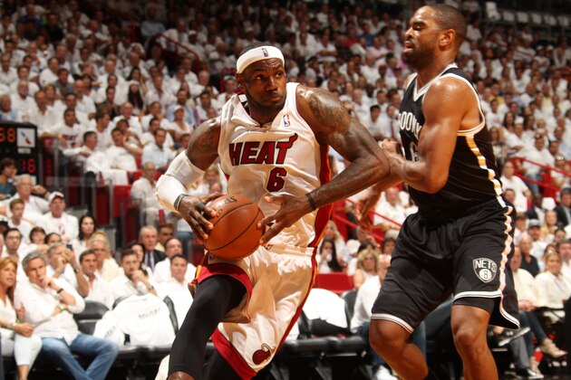 MIAMI, FL - MAY 6: LeBron James #6 of the Miami Heat drives to the basket against the Brooklyn Nets in Game One of the Eastern Conference Semi-Finals during the 2014 NBA Playoffs at American Airlines Arena on May 6, 2014 in Miami, Florida. NOTE TO USER: User expressly acknowledges and agrees that, by downloading and/or using this Photograph, user is consenting to the terms and conditions of the Getty Images License Agreement. Mandatory Copyright Notice: Copyright 2014 NBAE (Photo by Issac Baldizon/NBAE via Getty Images)