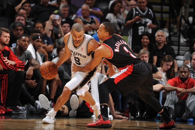 SAN ANTONIO, TX - MAY 6: Tony Parker #9 of the San Antonio Spurs drives against C.J. McCollum #3 of the Portland Trail Blazers in Game One of the Western Conference Semi-Finals during the 2014 NBA Playoffs at AT&T Center on May 6, 2014 in San Antonio, Texas. NOTE TO USER: User expressly acknowledges and agrees that, by downloading and/or using this Photograph, user is consenting to the terms and conditions of the Getty Images License Agreement. Mandatory Copyright Notice: Copyright 2014 NBAE (Photo by Garrett Ellwood/NBAE via Getty Images)