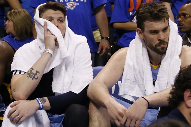 Memphis Grizzlies forward Mike Miller, left, and center Marc Gasol, right, sit on the bench in the fourth quarter of Game 7 of an opening-round NBA basketball playoff series against the Oklahoma City Thunder in Oklahoma City, Saturday, May 3, 2014. Oklahoma City won 120-109. (AP Photo/Sue Ogrocki)
