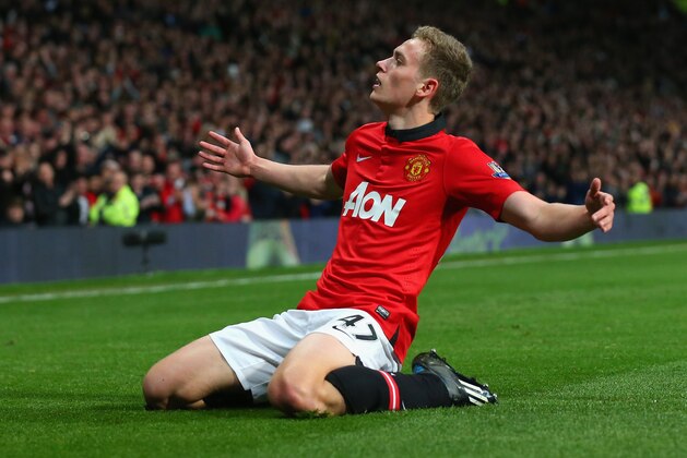 MANCHESTER, ENGLAND - MAY 06:  James Wilson of Manchester United celebrates scoring the second goal during the Barclays Premier League match between Manchester United and Hull City at Old Trafford on May 6, 2014 in Manchester, England.  (Photo by Alex Livesey/Getty Images)