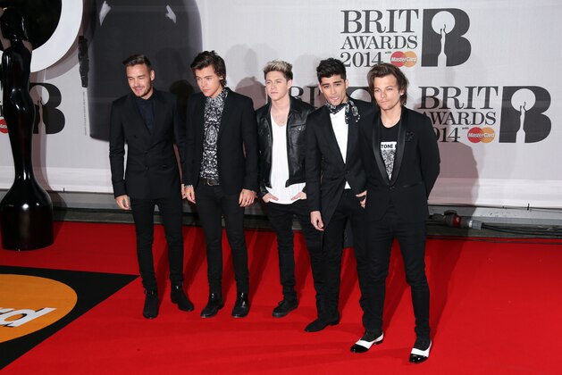 British band One Direction, from left, Liam Payne, Harry Styles, Niall Horan, Zayn Malik, and Louis Tomlinson arrive at the BRIT Awards 2014 at the O2 Arena in London on Wednesday, Feb. 19, 2014. (Photo by Joel Ryan/Invision/AP)