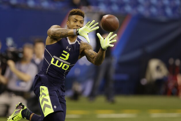 Louisiana State wide receiver Odell Beckham makes a catch during a drill at the NFL football scouting combine in Indianapolis, Sunday, Feb. 23, 2014. (AP Photo/Michael Conroy)