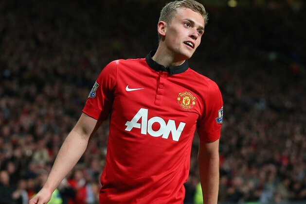 MANCHESTER, ENGLAND - MAY 06:  James Wilson of Manchester United celebrates scoring the second goal during the Barclays Premier League match between Manchester United and Hull City at Old Trafford on May 6, 2014 in Manchester, England.  (Photo by Alex Livesey/Getty Images)