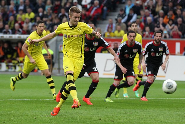 Dortmund's Marco Reus scores his side's equalizing goal by penalty during a German Bundesliga soccer match between Bayer 04 Leverkusen and Borussia Dortmund in Leverkusen, Germany, Saturday, April 26, 2014. (AP Photo/Michael Probst)