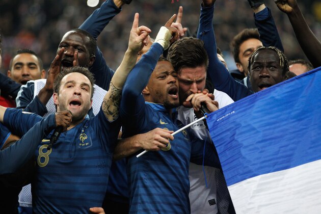 PARIS, FRANCE - NOVEMBER 19: (L-R) Mathieu Valbuena, Patrice Evra, Olivier Giroud and Bacary Sagna of France sing the Marseillaise after they won the FIFA 2014 World Cup Qualifier 2nd Leg Playoff between France and Ukraine at the Stade de France on November 19, 2013 in Paris, France.  (Photo by Harry Engels/Getty Images)