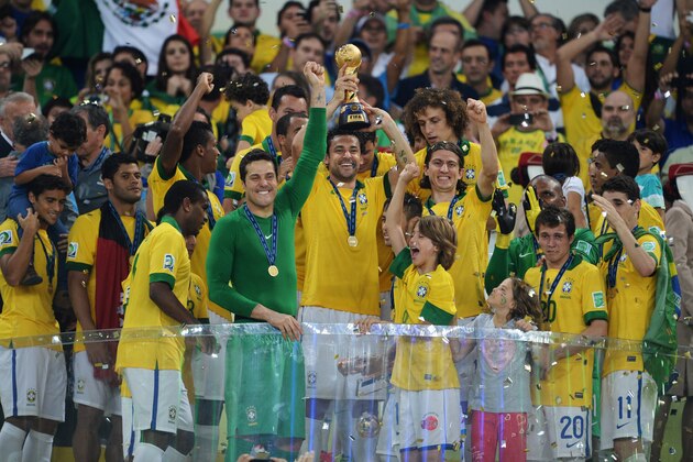 RIO DE JANEIRO, BRAZIL - JUNE 30:  Fred of Brazil lifts the trophy alongside team mates during the FIFA Confederations Cup Brazil 2013 Final match between Brazil and Spain at Maracana on June 30, 2013 in Rio de Janeiro, Brazil.  (Photo by Michael Regan/Getty Images)