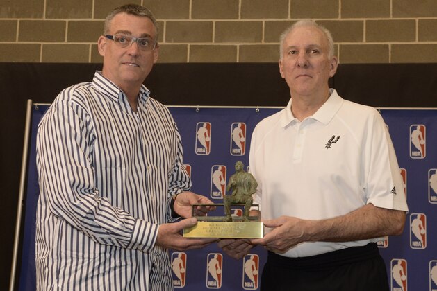 SAN ANTONIO, TX - April 22: San Antonio Spurs (l to r) R. C. Buford, President of Spurs Franchises and Gregg Popovich, Head Coach and President of Spurs Basketball, hold the Red Auerbach Trophy at the Press Conference naming Popovich 2013-2014 NBA Coach of the Year at the Spurs Practice Facility on April 22, 2014 in San Antonio, Texas. NOTE TO USER: User expressly acknowledges and agrees that, by downloading and or using this photograph, user is consenting to the terms and conditions of the Getty Images License Agreement. Mandatory Copyright Notice: Copyright 2014 NBAE (Photos by D. Clarke Evans/NBAE via Getty Images)