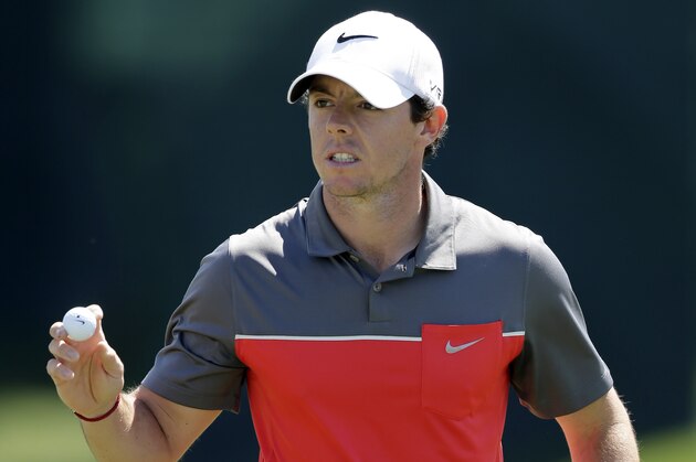 Rory McIlroy, of Northern Ireland, waves to the crowd after making par on the 16th hole during the third round of the Wells Fargo Championship golf tournament in Charlotte, N.C., Saturday, May 3, 2014. (AP Photo/Chuck Burton)