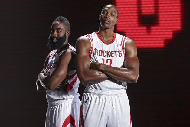 Sep 27, 2013; Houston, TX, USA;  Houston Rockets shooting guard James Harden (13) and center Dwight Howard (12) pose for a picture during media day at Toyota Center. Mandatory Credit: Troy Taormina-USA TODAY Sports