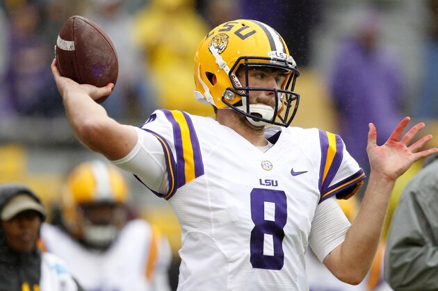 LSU quarterback Zach Mettenberger (8) warms up before an NCAA college football game against Texas A&M in Baton Rouge, La., Saturday, Nov. 23, 2013. (AP Photo/Gerald Herbert)