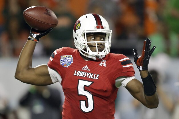 ADVANCE FOR USE WEEKEND, MAY 3-4 - FILE - In this Dec. 28, 2013, file photo, Louisville quarterback Teddy Bridgewater throws a pass during the first half of the Russell Athletic Bowl NCAA college football game against Miami in Orlando, Fla. With a record 102 underclassmen declaring for this NFL draft, the depth of talent is obvious. Quarterbacks are no exception, with a trio of potential top-10 picks available and another half-dozen or so prospects projected as viable mid-round options. (AP Photo/John Raoux, File)