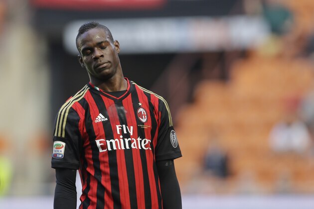 AC Milan forward Mario Balotelli closes his eyes after missing a scoring chance during a Serie A soccer match between AC Milan and Parma, at the San Siro stadium in Milan, Italy, Sunday, March 16, 2014. (AP Photo/Luca Bruno)