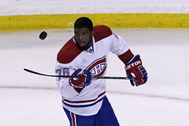 Montreal Canadiens defenseman P.K. Subban flips the puck prior to facing the Boston Bruins in Game 2 in the second-round of the Stanley Cup hockey playoff series in Boston, Saturday, May 3, 2014. (AP Photo/Charles Krupa)