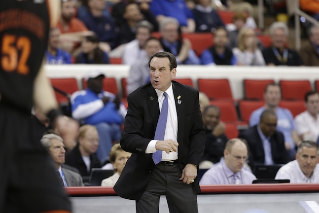 Duke head coach Mike Krzyzewski calls a play against Mercer during the first half of an NCAA college basketball second-round game, Friday, March 21, 2014, in Raleigh, N.C. (AP Photo/Chuck Burton)