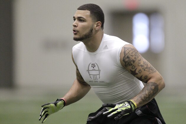 Texas A&M wide receiver Mike Evans works out during pro day for NFL football representatives in College Station, Texas, Thursday, March 27, 2014. (AP Photo/Patric Schneider)