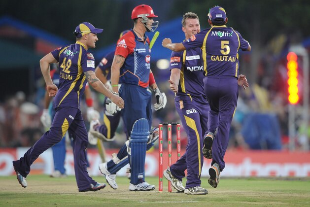 PRETORIA, SOUTH AFRCA - OCTOBER 13:  Brett Lee (2nd R) of the Knight Riders celebrates capturing the wicket of Kevin Pietersen (2nd L) of the Daredevils with Brendon McCullum (L) and Gautam Gambhir (R) during the Karbonn Smart CLT20 Group A match between Kolkata Knight Riders (IPL) and Delhi Daredevils (IPL) at SuperSport Park on October 13, 2012 in Pretoria, South Africa.  (Photo by Lee Warren/Gallo Images/Getty Images)