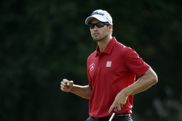 Adam Scott, of Australia, pumps his fist after a birdie putt on the 15th green during the second round of the Masters golf tournament Friday, April 11, 2014, in Augusta, Ga. (AP Photo/Chris Carlson)