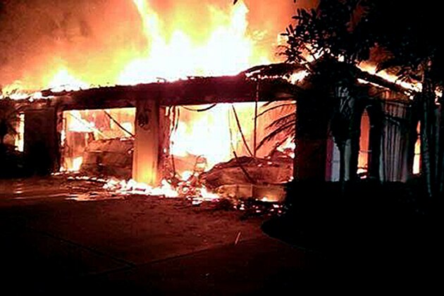 In this photo provided by the Hillsborough County Sheriff's Office, flames destroy a mansion owned by former tennis star James Blake Wednesday May 7, 2014, in a gated community  in Tampa, Fla. Officials have confirmed that three bodies have been found in the home. Hillsborough County Sheriff's Spokeswoman Cristal Bermudez Nunez says neighbors have told detectives that Blake hasn't lived in the house for a while and was renting it out. (AP Photo/Hillsborough County Sheriff's Office)