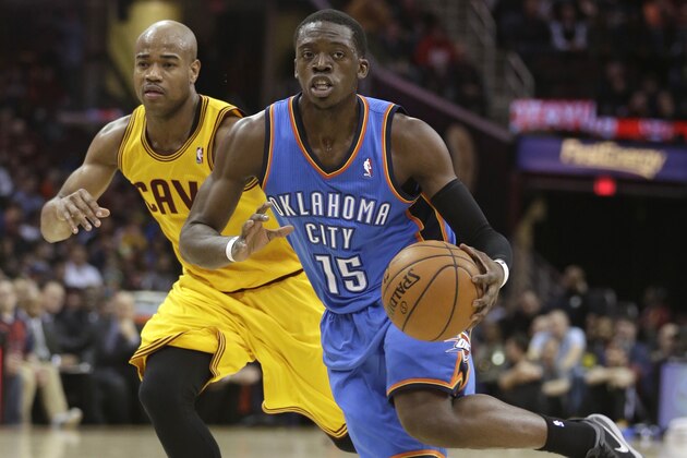 Oklahoma City Thunder's Reggie Jackson (15) drives past Cleveland Cavaliers' Jarrett Jack (1) during an NBA basketball game Thursday, March 20, 2014, in Cleveland. (AP Photo/Tony Dejak)