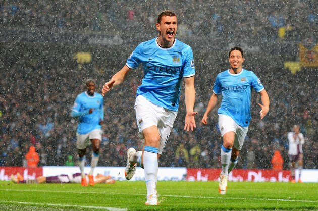 MANCHESTER, ENGLAND - MAY 07:  Edin Dzeko of Manchester City celebrates scoring the opening goal during the Barclays Premier League match between Manchester City and Aston Villa at Etihad Stadium on May 7, 2014 in Manchester, England.  (Photo by Michael Regan/Getty Images)