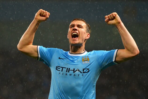 MANCHESTER, ENGLAND - MAY 07:  Edin Dzeko of Manchester City celebrates scoring the opening goal during the Barclays Premier League match between Manchester City and Aston Villa at Etihad Stadium on May 7, 2014 in Manchester, England.  (Photo by Michael Regan/Getty Images)