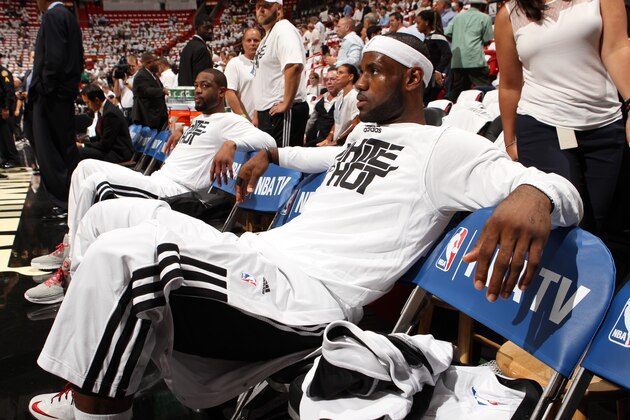 MIAMI, FL - MAY 6: LeBron James #6 and Dwyane Wade #3 of the Miami Heat get ready before Game One of the Eastern Conference Semi-Finals against the Brooklyn Nets during the 2014 NBA Playoffs at American Airlines Arena on May 6, 2014 in Miami, Florida. NOTE TO USER: User expressly acknowledges and agrees that, by downloading and/or using this Photograph, user is consenting to the terms and conditions of the Getty Images License Agreement. Mandatory Copyright Notice: Copyright 2014 NBAE (Photo by Issac Baldizon/NBAE via Getty Images)