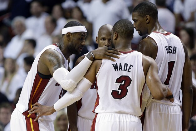 Miami Heat's LeBron James, left, Dwyane Wade (3), Chris Bosh (1) and Ray Allen, center, huddle on the court in the second half of Game 1 in an NBA basketball Eastern Conference semifinal playoff series against the Brooklyn Nets, Tuesday, May 6, 2014, in Miami. The Heat defeated the Nets 107-86. (AP Photo/Lynne Sladky)