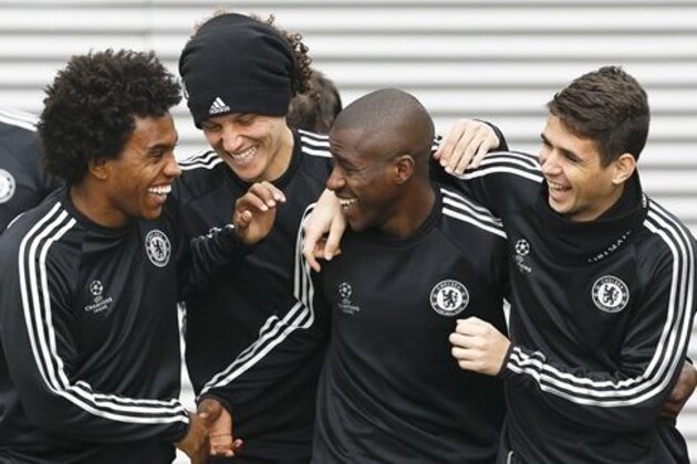 CORRECTS PLAYERS NAME TO OSCAR - Chelsea's players Willian, left, David Luiz, second left, Ramires, second right, and Oscar, right, arrive for a training session at Cobham in England Tuesday, April 29, 2014. Chelsea will play in a Champions League semifinal second leg soccer match against Atletico Madrid on Wednesday. (AP Photo/Kirsty Wigglesworth)