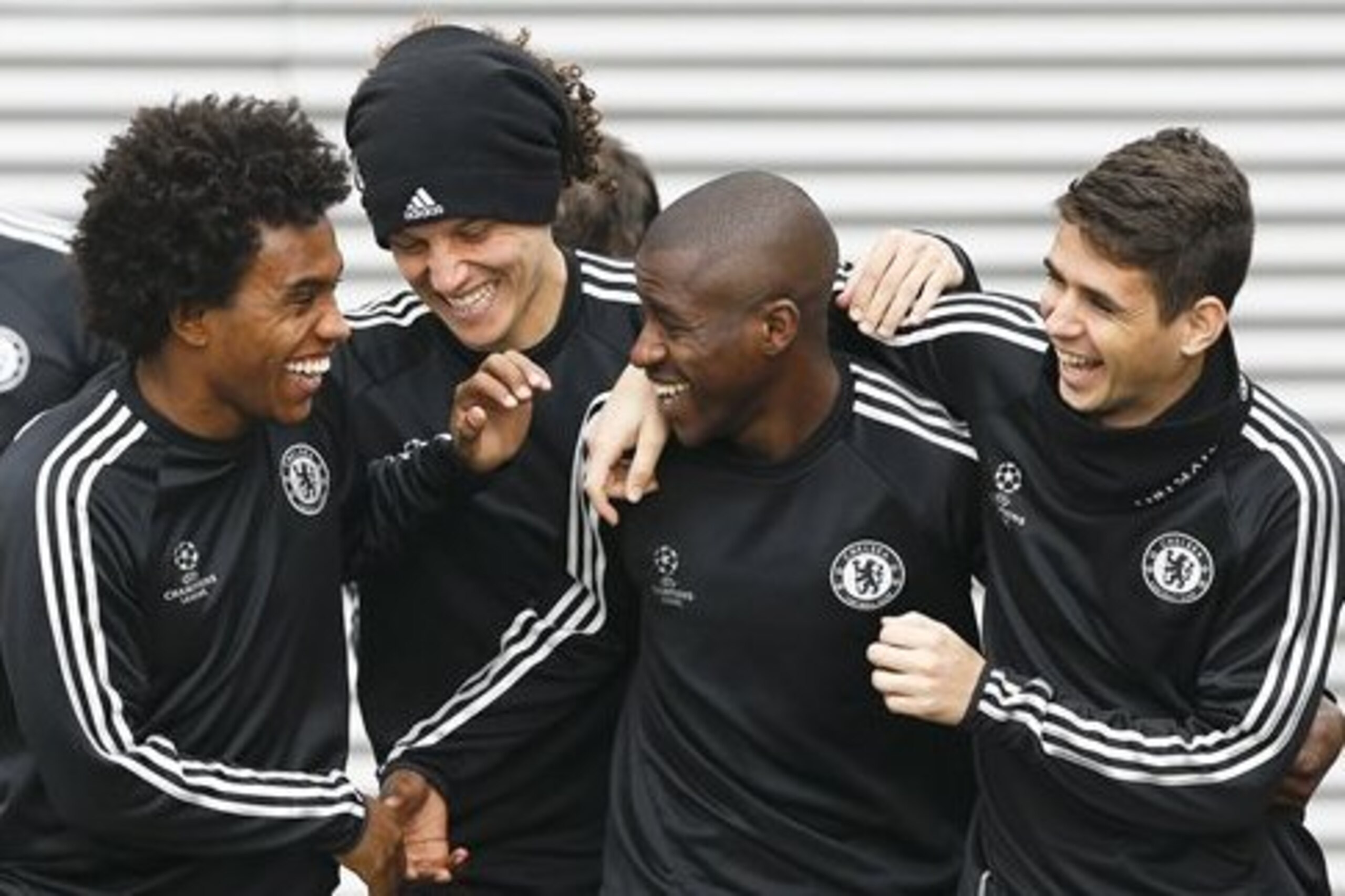 CORRECTS PLAYERS NAME TO OSCAR - Chelsea's players Willian, left, David Luiz, second left, Ramires, second right, and Oscar, right, arrive for a training session at Cobham in England Tuesday, April 29, 2014. Chelsea will play in a Champions League semifinal second leg soccer match against Atletico Madrid on Wednesday. (AP Photo/Kirsty Wigglesworth)