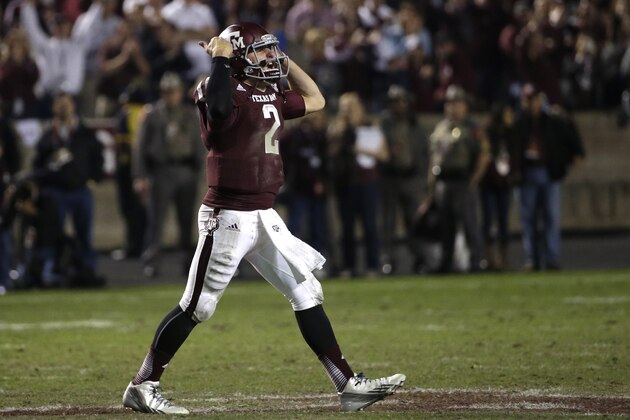 Texas A&M quarterback Johnny Manziel (2) encourages the crowd during the fourth quarter of an NCAA college football game against Mississippi State Saturday, Nov. 9, 2013, in College Station, Texas. Texas A&M won 51-41. (AP Photo/David J. Phillip)