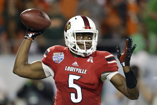 ADVANCE FOR USE WEEKEND, MAY 3-4 - FILE - In this Dec. 28, 2013, file photo, Louisville quarterback Teddy Bridgewater throws a pass during the first half of the Russell Athletic Bowl NCAA college football game against Miami in Orlando, Fla. With a record 102 underclassmen declaring for this NFL draft, the depth of talent is obvious. Quarterbacks are no exception, with a trio of potential top-10 picks available and another half-dozen or so prospects projected as viable mid-round options. (AP Photo/John Raoux, File)