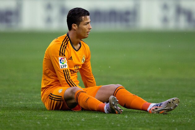 VALLADOLID, SPAIN - MAY 07: Cristiano Ronaldo of Real Madrid CF lies on the ground after being tackled during the La Liga match between Real Valladolid CF and Real Madrid CF at Estadio Jose Zorilla on May 7, 2014 in Valladolid, Spain.  (Photo by Gonzalo Arroyo Moreno/Getty Images)