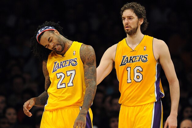 November 9, 2012; Los Angeles, CA, USA;   Los Angeles Lakers power forward Pau Gasol (16) looks on as center Jordan Hill (27) stretches his neck after he was fouled in the first half of the game at the Staples Center. Mandatory Credit: Jayne Kamin-Oncea-USA TODAY Sports