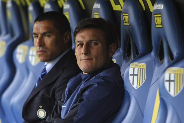 PARMA, ITALY - APRIL 19:  Javier Zanetti (R) and Ivan Cordoba (L) of FC Internazionale Milano look on before the Serie A match between Parma FC and FC Internazionale Milano at Stadio Ennio Tardini on April 19, 2014 in Parma, Italy.  (Photo by Marco Luzzani/Getty Images)