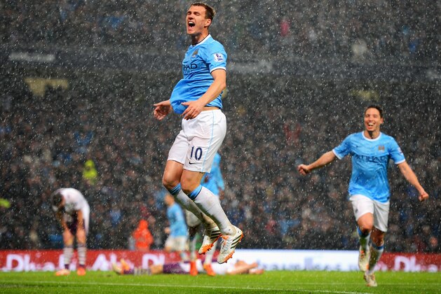 MANCHESTER, ENGLAND - MAY 07: Edin Dzeko of Manchester City celebrates scoring the opening goal during the Barclays Premier League match between Manchester City and Aston Villa at Etihad Stadium on May 7, 2014 in Manchester, England. (Photo by Michael Regan/Getty Images) MANCHESTER, ENGLAND - MAY 07: Edin Dzeko of Manchester City celebrates scoring the opening goal during the Barclays Premier League match between Manchester City and Aston Villa at Etihad Stadium on May 7, 2014 in Manchester, England. (Photo by Michael Regan/Getty Images)