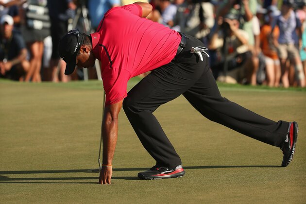 DORAL, FL - MARCH 09:  Tiger Woods collects his golf ball during the final round of the World Golf Championships-Cadillac Championship at Trump National Doral on March 9, 2014 in Doral, Florida.  (Photo by Mike Ehrmann/Getty Images)
