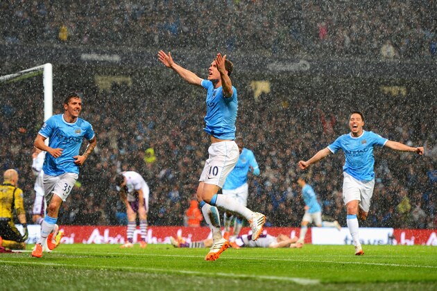 MANCHESTER, ENGLAND - MAY 07:  Edin Dzeko of Manchester City celebrates scoring the opening goal during the Barclays Premier League match between Manchester City and Aston Villa at Etihad Stadium on May 7, 2014 in Manchester, England.  (Photo by Michael Regan/Getty Images)