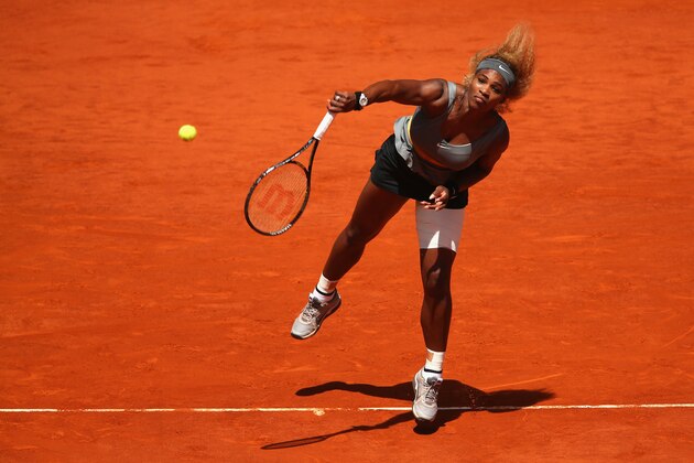 MADRID, SPAIN - MAY 08:  Serena Williams of the United States serves against Carla Suarez Navarro of Spain in their third round match during day six of the Mutua Madrid Open tennis tournament at the Caja Magica on May 8, 2014 in Madrid, Spain.  (Photo by Clive Brunskill/Getty Images)