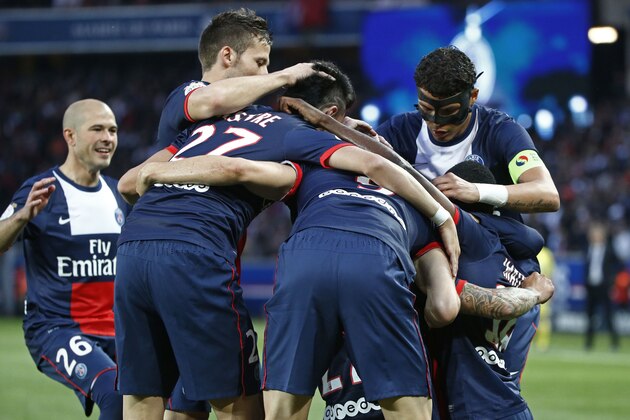 Paris Saint-Germain's players celebrate the opening goal during a French league one soccer match between Paris-Saint-Germain and Rennes at Parc des Princes stadium in Paris, Wednesday, May 7, 2014. Paris Saint Germain clinched their second straight French league title on Wednesday after rival Monaco drew 1-1 against French Cup holder Guingamp. (AP Photo/Michel Euler)
