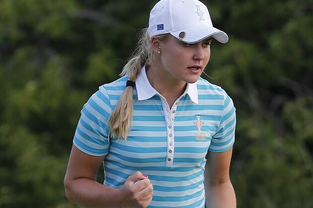 Europe's Charley Hull, from England, reacts after making a birdie putt on the 17th hole during a fourball match against the United States at the Solheim Cup golf tournament on Saturday, Aug. 17, 2013, in Parker, Colo. (AP Photo/Ed Andrieski)
