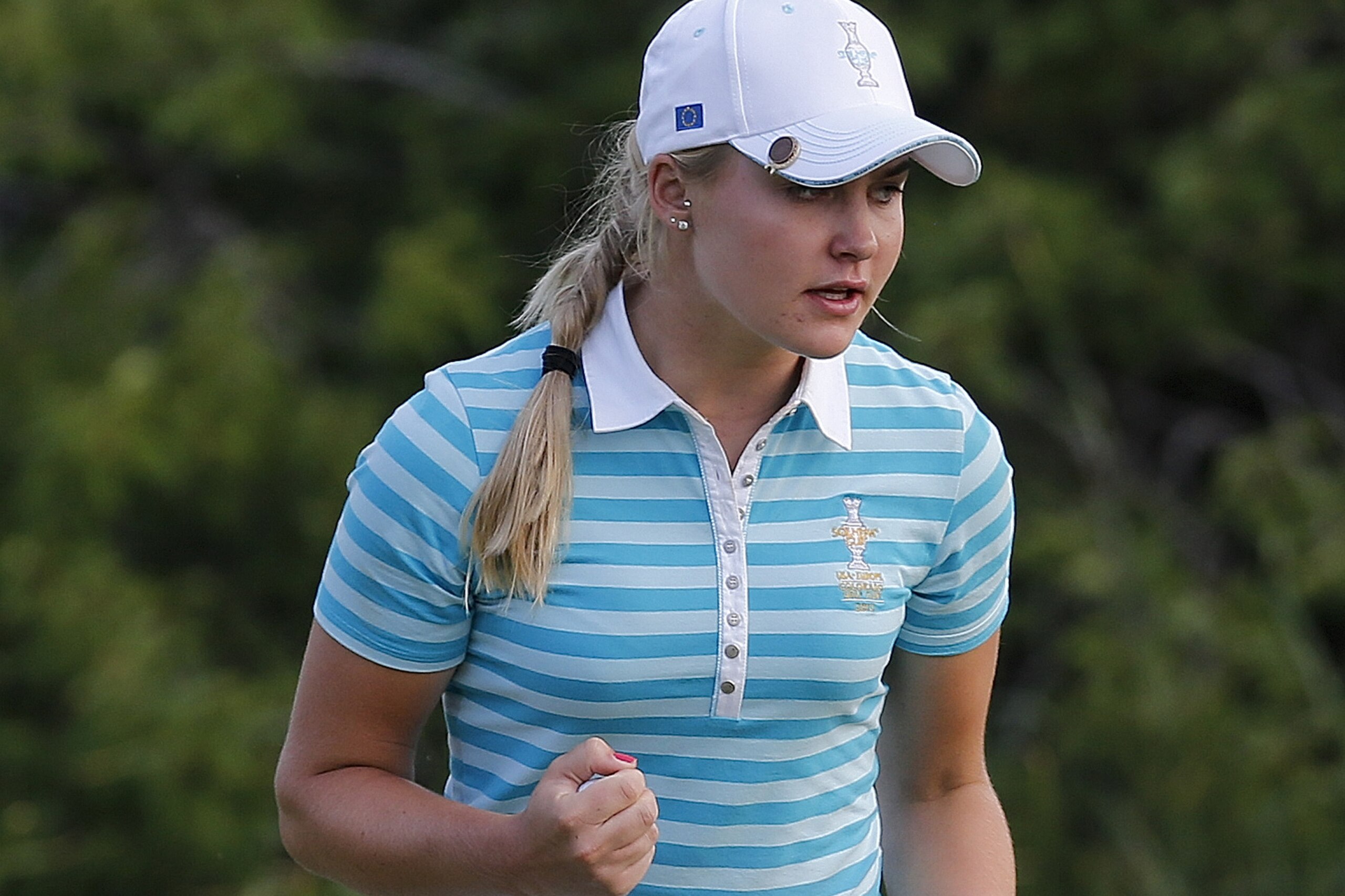 Europe's Charley Hull, from England, reacts after making a birdie putt on the 17th hole during a fourball match against the United States at the Solheim Cup golf tournament on Saturday, Aug. 17, 2013, in Parker, Colo. (AP Photo/Ed Andrieski)