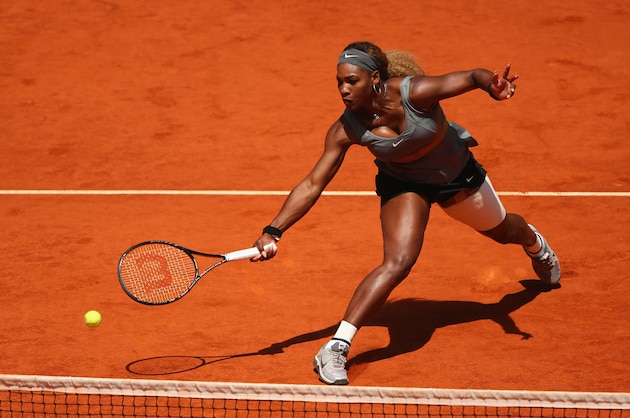 MADRID, SPAIN - MAY 08:  Serena Williams of the United States plays a forehand volley against Carla Suarez Navarro of Spain in their third round match during day six of the Mutua Madrid Open tennis tournament at the Caja Magica on May 8, 2014 in Madrid, Spain.  (Photo by Clive Brunskill/Getty Images)