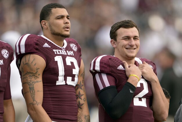 Nov 9, 2013; College Station, TX, USA; Texas A&M Aggies quarterback Johnny Manziel (2) and wide receiver Mike Evans (13) before the game against the Mississippi State Bulldogs at Kyle Field. Mandatory Credit: Thomas Campbell-USA TODAY Sports