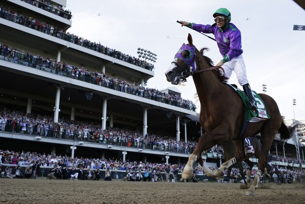 Victor Espinoza rides California Chrome to victory during the 140th running of the Kentucky Derby horse race at Churchill Downs Saturday, May 3, 2014, in Louisville, Ky.  (AP Photo/David J. Phillip)