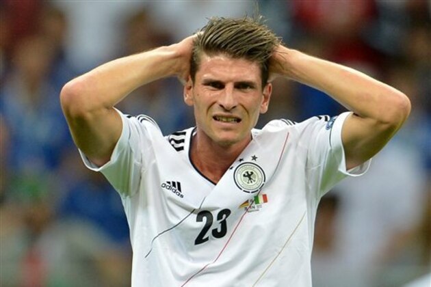 FILE - In this June 28, 2012 file picture German national soccer player Mario Gomez reacts during the semifinal match of the Euro 2012 soccer championships between Germany and Italy in Warsaw, Poland. Despite scoring 41 goals in 52 games for Bayern Munich last season, Mario Gomez is unsure of his place in the team. After finishing runner-up in the Bundesliga and then losing in the German Cup and Champions League finals, Bayern bolstered its attacking options in the offseason by bringing in Croatia striker Mario Mandzukic and Peru forward Claudio Pizarro. (AP Photo/dapd/ Torsten Silz, File)