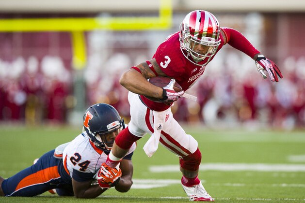 Indiana's Cody Latimer (3) is tackled by Illinois' Darius Mosely (24) during the first half of an NCAA college football game, Saturday, Nov. 9, 2013, in Bloomington, Ind. (AP Photo/Doug McSchooler)