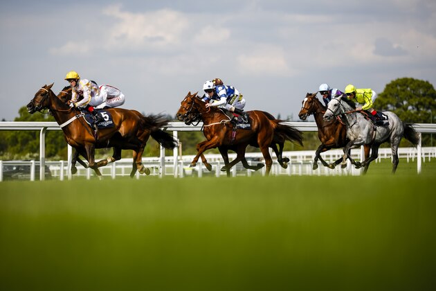 ASCOT, ENGLAND - APRIL 30:  Frankie Dettori rides Tac De Boistron (R) to victory in The Longines Sagari Stakes at Discover Ascot Raceday at Ascot Racecourse on April 30, 2014 in Ascot, England.  (Photo by Miles Willis/Getty Images for Ascot Racecourse)