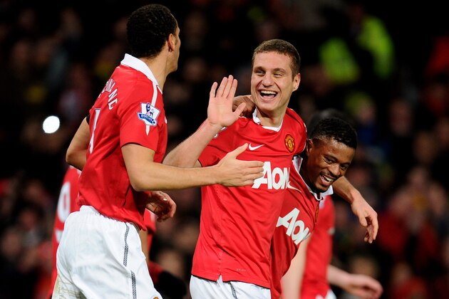 MANCHESTER, ENGLAND - FEBRUARY 01:  Nemanja Vidic of Manchester United celebrates scoring his team's third goal with team mates Rio Ferdinand and Patrice Evra (R) during the Barclays Premier League match between Manchester United and Aston Villa at Old Trafford on February 1, 2011 in Manchester, England.  (Photo by Clive Mason/Getty Images)